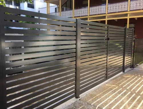 Aluminium slat fence installed beside a modern home