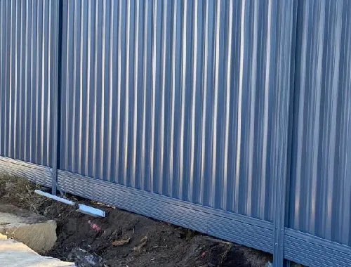 Colorbond boundary fence with aluminium sleeper for a clean modern finish