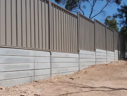 Colorbond fence built with sleeper base for residential boundary support