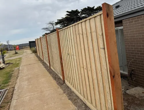 Exposed post paling fence installed for a classic timber boundary look