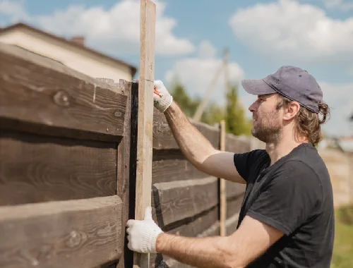 Residential fence repair work on damaged posts, rails or panels