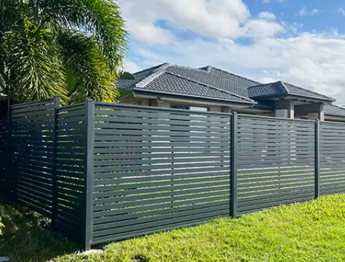 Modern slat fencing and privacy screens for a residential property