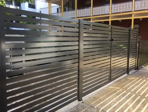 Aluminium slat fence installed beside a modern home