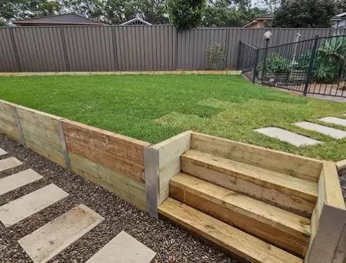 Timber sleeper retaining wall built for a sloped residential yard